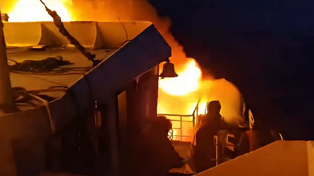 Flames engulf a ferry as a fire erupted in the night